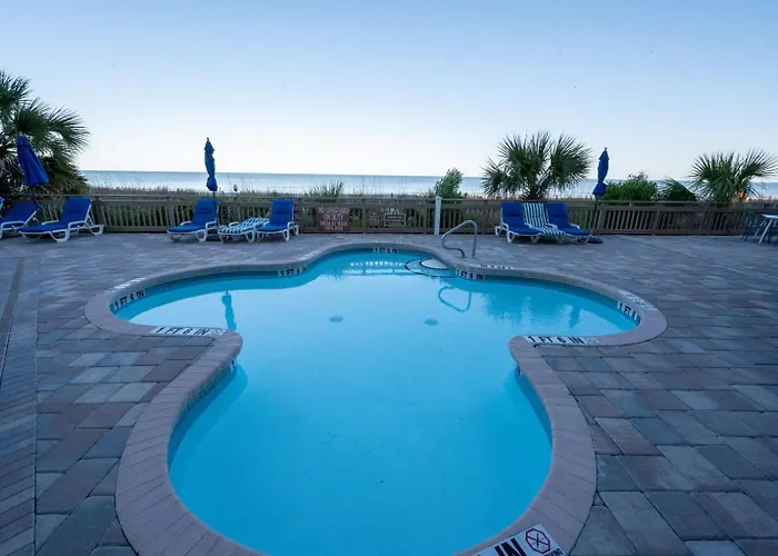 Oceanfront Remodeled Condo With Pools, Coral Beach